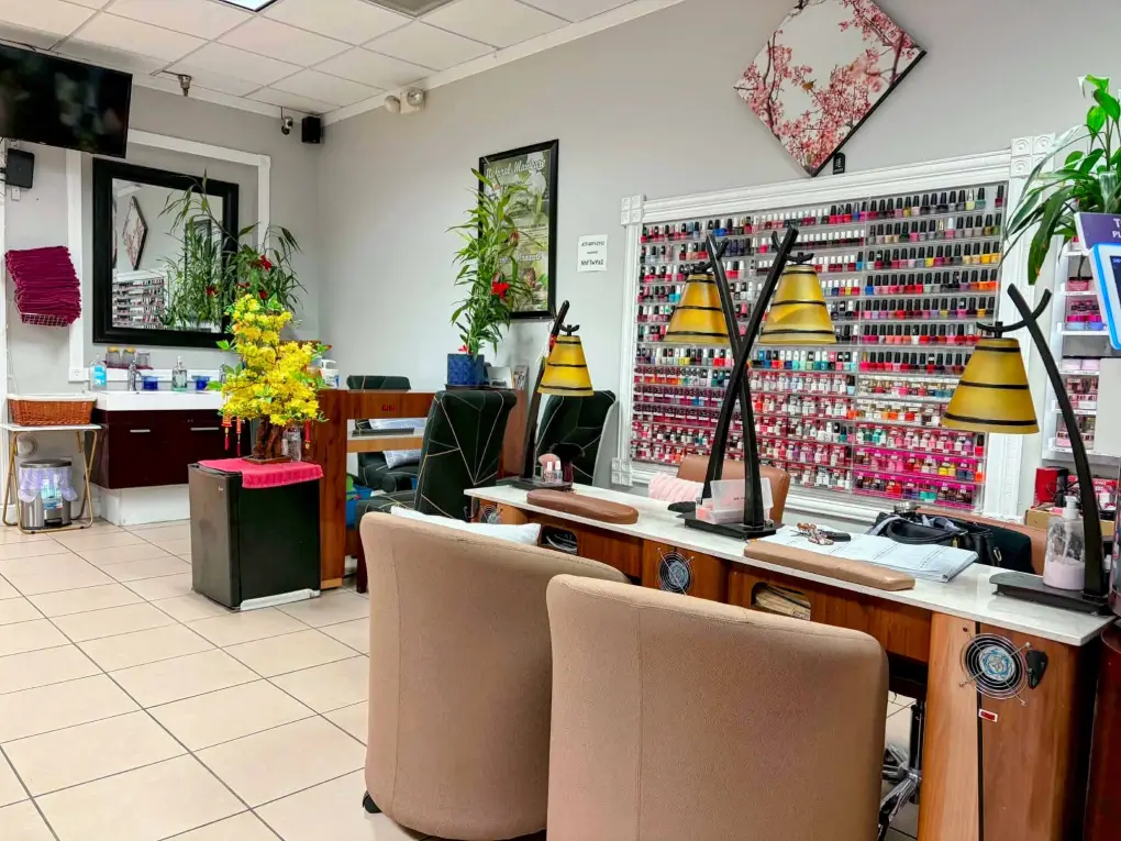 Wall of nail polish colors beside a manicure station